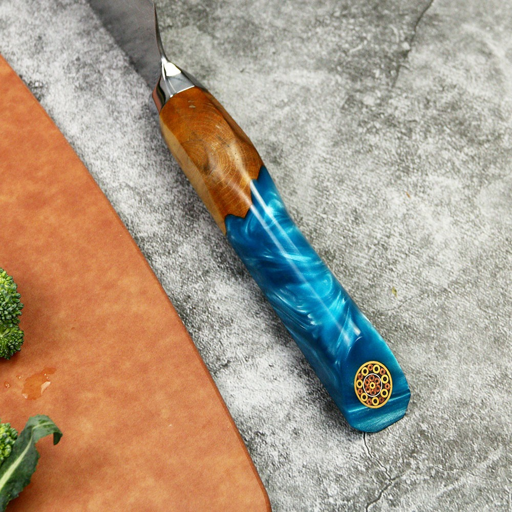 Santoku colored Line knife with VG10 Damascus steel blade and blue epoxy resin wood handle.